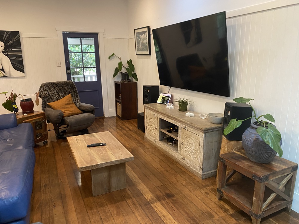Living room with timber floors and a cosy armchair